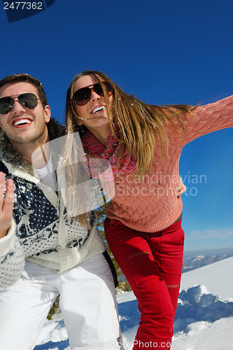 Image of Young Couple In Winter  Snow Scene