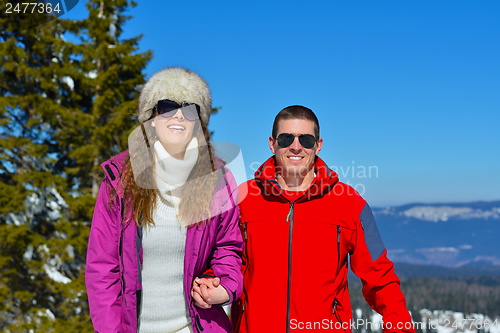 Image of Young Couple In Winter  Snow Scene