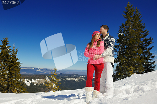 Image of Young Couple In Winter  Snow Scene