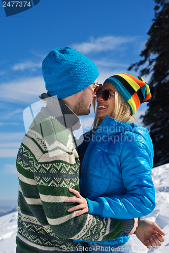 Image of Young Couple In Winter  Snow Scene