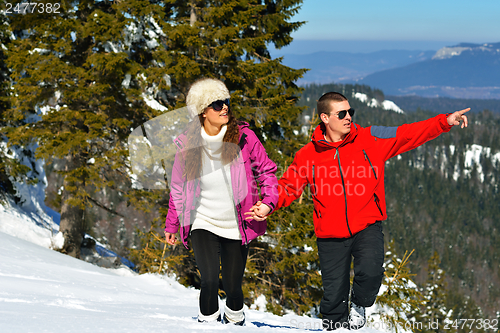 Image of Young Couple In Winter  Snow Scene