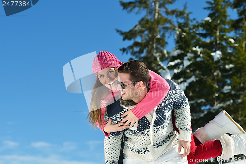 Image of Young Couple In Winter  Snow Scene