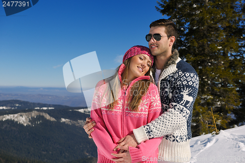 Image of Young Couple In Winter  Snow Scene