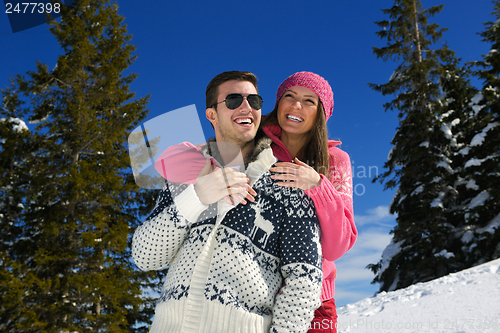 Image of Young Couple In Winter  Snow Scene