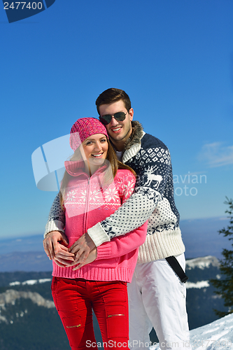 Image of Young Couple In Winter  Snow Scene