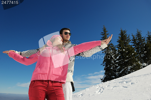 Image of Young Couple In Winter  Snow Scene