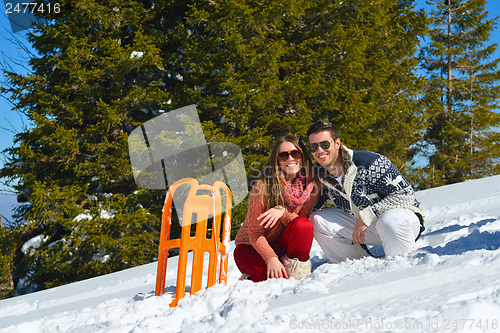 Image of Young Couple In Winter  Snow Scene