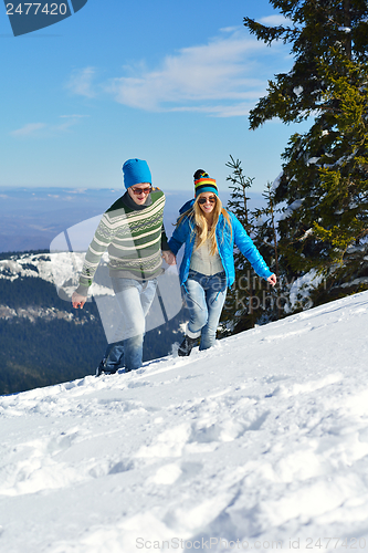 Image of Young Couple In Winter  Snow Scene