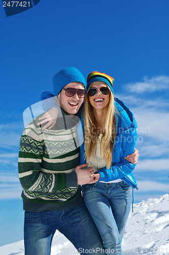 Image of Young Couple In Winter  Snow Scene