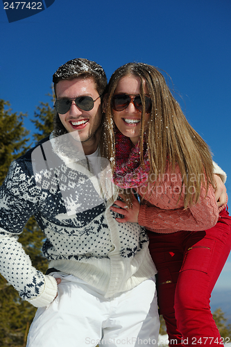 Image of Young Couple In Winter  Snow Scene