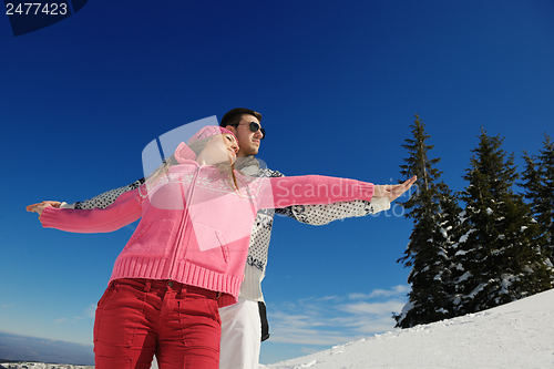 Image of Young Couple In Winter  Snow Scene