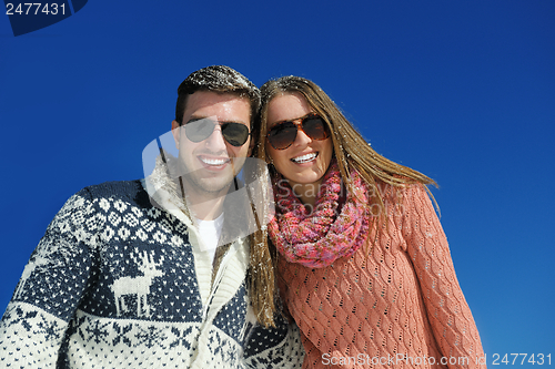 Image of Young Couple In Winter  Snow Scene