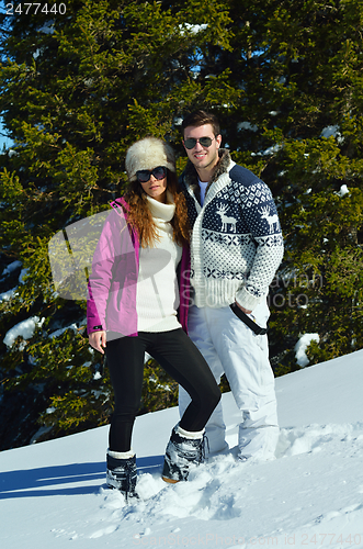 Image of Young Couple In Winter  Snow Scene