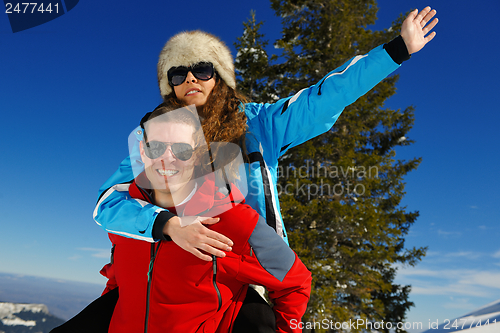 Image of Young Couple In Winter  Snow Scene