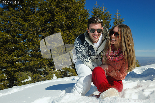 Image of Young Couple In Winter  Snow Scene