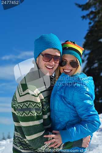 Image of Young Couple In Winter  Snow Scene