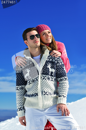 Image of Young Couple In Winter  Snow Scene