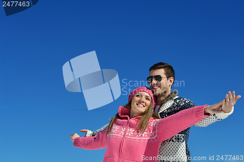 Image of Young Couple In Winter  Snow Scene