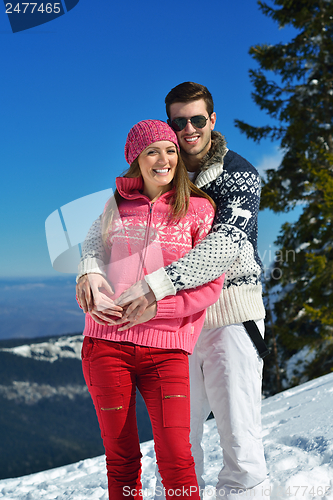 Image of Young Couple In Winter  Snow Scene