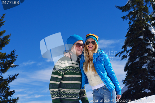 Image of Young Couple In Winter  Snow Scene