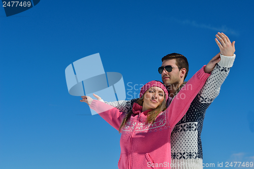 Image of Young Couple In Winter  Snow Scene