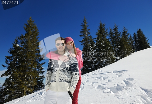 Image of Young Couple In Winter  Snow Scene