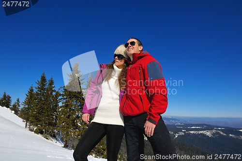 Image of Young Couple In Winter  Snow Scene