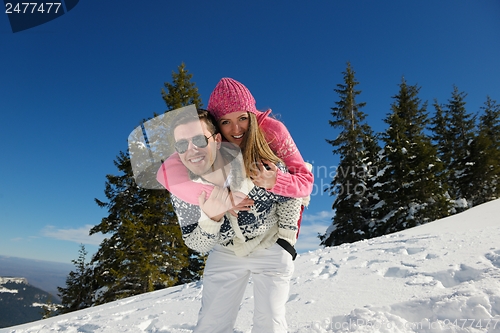 Image of Young Couple In Winter  Snow Scene