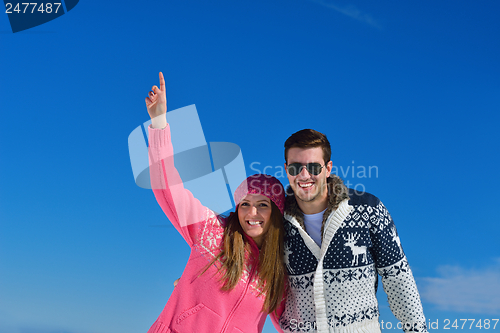 Image of Young Couple In Winter  Snow Scene