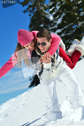 Image of Young Couple In Winter  Snow Scene