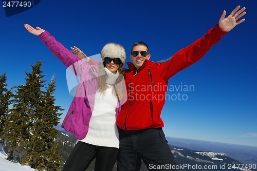 Image of Young Couple In Winter  Snow Scene