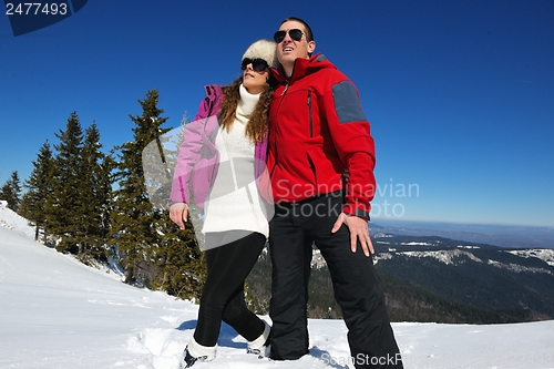 Image of Young Couple In Winter  Snow Scene