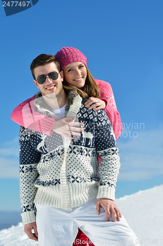 Image of Young Couple In Winter  Snow Scene