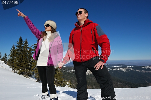 Image of Young Couple In Winter  Snow Scene