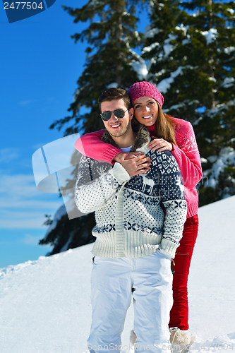 Image of Young Couple In Winter  Snow Scene