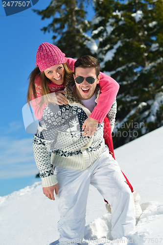 Image of Young Couple In Winter  Snow Scene