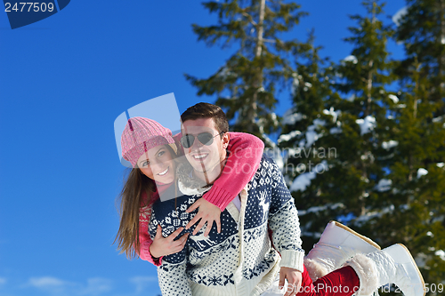 Image of Young Couple In Winter  Snow Scene