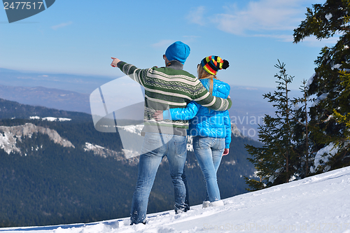 Image of Young Couple In Winter  Snow Scene