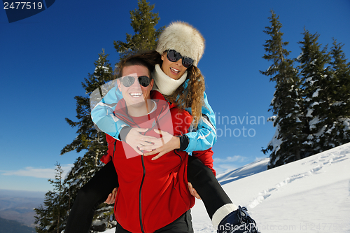 Image of Young Couple In Winter  Snow Scene