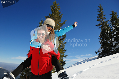 Image of Young Couple In Winter  Snow Scene