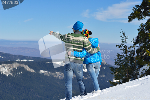 Image of Young Couple In Winter  Snow Scene