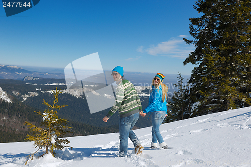 Image of Young Couple In Winter  Snow Scene