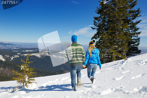 Image of Young Couple In Winter  Snow Scene