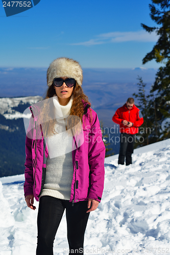 Image of Young Couple In Winter  Snow Scene