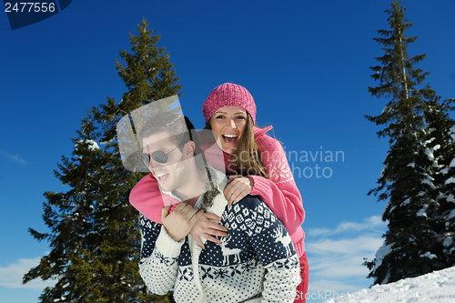 Image of Young Couple In Winter  Snow Scene