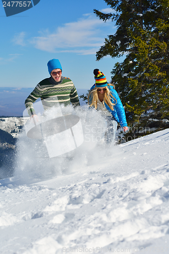 Image of Young Couple In Winter  Snow Scene