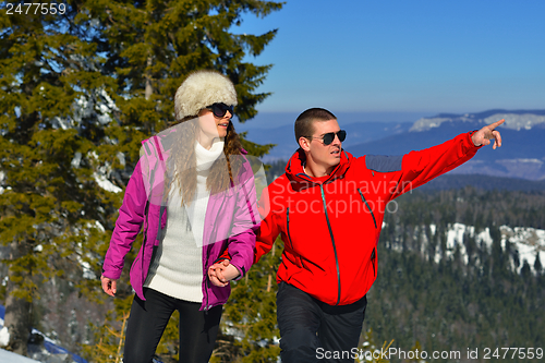 Image of Young Couple In Winter  Snow Scene