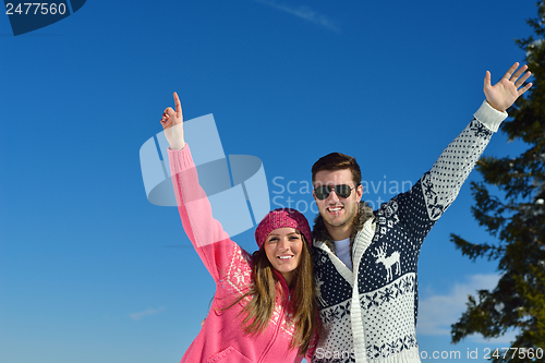 Image of Young Couple In Winter  Snow Scene