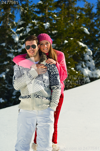 Image of Young Couple In Winter  Snow Scene