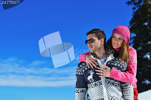 Image of Young Couple In Winter  Snow Scene